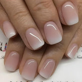 Juggssa short square press-on nails with French ombre finish for a salon-like manicure.
