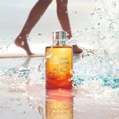 Juliette Has A Gun Lust for Sun cap close-up, portable for on-the-go touch-ups.