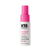 K18 HeatBounce bottle pouring for lightweight leave-in protection across hair types