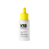 K18 Molecular Repair Hair Oil bottle pour showing weightless shine.