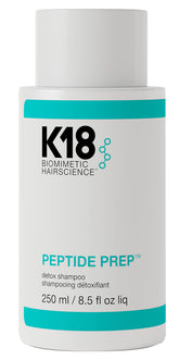K18 Peptide Prep Detox Shampoo bottle pour shows cleansing action and buildup removal