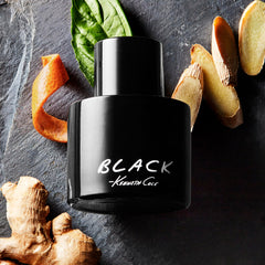 Kenneth Cole Black bottle on wood surface evokes tuxedo-inspired elegance.