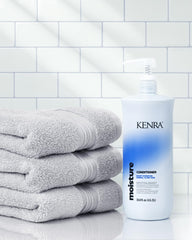 Applying Kenra Moisture Conditioner to damp hair suggests detangling ease.