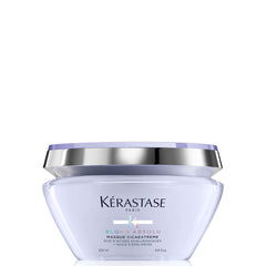 Kerastase Blond Absolu Cicaextreme mask application on damp hair for deep nourishment.
