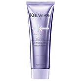 KÉRASTASE Blond Absolu Cicaflash conditioner bottle pouring to hydrate color-treated hair
