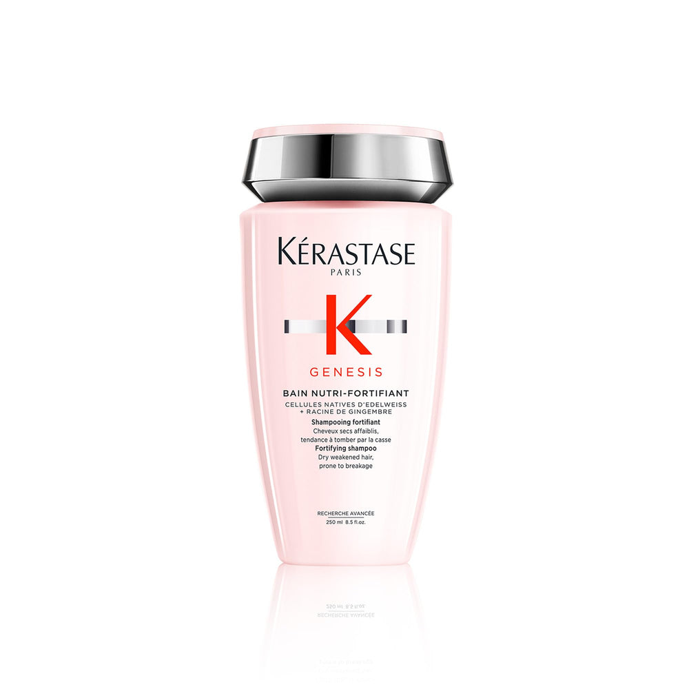 Kérastase Genesis Strengthening Shampoo bottle on counter supports scalp cleansing and hair fortification.