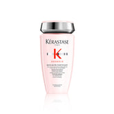Kérastase Genesis Strengthening Shampoo bottle on counter supports scalp cleansing and hair fortification.