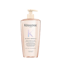 Kerastase Gloss Absolu bottle close-up highlighting hydration benefits.