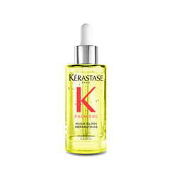 KÉRASTASE Première Repairing Gloss Oil bottle boosts shine and smoothness.