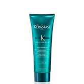 Kerastase Resistance Bain Therapiste bottle pouring, repairing formula for damaged hair.