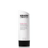 Keratin Complex Color Care Smoothing Shampoo bottle pour for smooth, frizz-free color-treated hair.