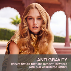 Hands applying KEVIN.MURPHY ANTI.GRAVITY for lift and texture without heaviness