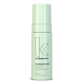 KEVIN.MURPHY HEATED.DEFENSE bottle closeup showing heat protection for all hair types.