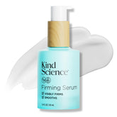 Kind Science Firming Serum bottle closeup, fragrance-free formula for sensitive skin.