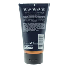 Close-up of King C. Gillette gel being applied for edge control.