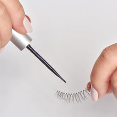 KISS SuperStick brush applicator shown for quick, precise lash application.