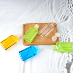 Kitchen GIMS screw-on flip-cap bottle keeps liquids sealed during travel.