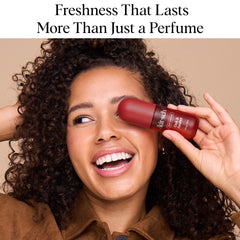 Kitsch Oak Amber hair perfume being applied to hair for a subtle evening fragrance.