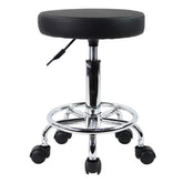 KKTONER PU leather round stool ready for assembly in a compact workspace.
