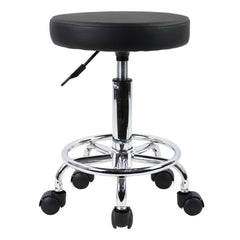 KKTONER PU leather round stool ready for assembly in a compact workspace.