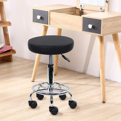 KKTONER leather round stool with swivel seat in professional use.