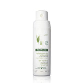 Klorane Dry Shampoo Oat Milk bottle dispensing powder for quick refresh between washes.
