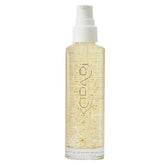 Kopari Golden Aura oil bottle with 24k gold detail for radiant hydration.