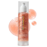 Kopari Sun Shield Body Glow bottle cap close-up showing rose gold shimmer and SPF 45 protection.