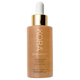 KORA Organics Noni Glow bottle close-up highlights radiant hydration.