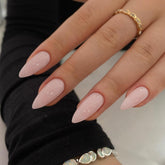 KQueenest dusty pink press-on nails on hand show natural almond fit for daily wear