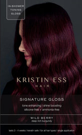 Kristin Ess Hair Gloss Wild Berry Red bottle demonstrates in-shower color deposit and shine.