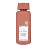 Kristin Ess Moisture Rich Conditioner bottle demonstrates hydrated, frizz-controlled curls.