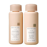 Kristin Ess One Signature Shampoo bottle close-up, showcasing moisture and shine.