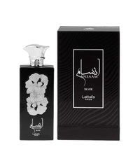 Lattafa Ansaam Silver bottle close-up, warm amber-vanilla base for versatile wear