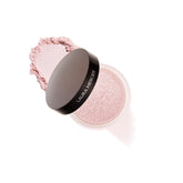 Laura Mercier Secret Brightening powder compact demonstrating ultra-light application.