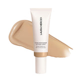 Laura Mercier Tinted Moisturizer Natural Dewy SPF 30 bottle delivers hydrated coverage.