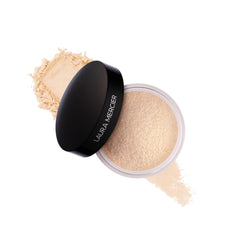 Laura Mercier translucent loose setting powder compact for long wear and shine control.