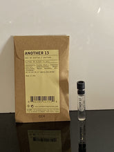 Le Labo Another 13 dabber sample bottle showing compact portability for on-the-go use.