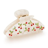 Pinzas acrílicas LILIE&WHITE con cereza roja y cristales de strass para brillo en el peinado