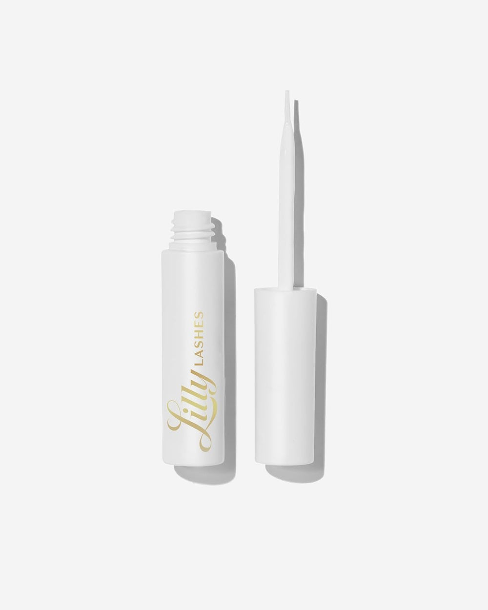 Lilly Lashes clear glue with brush-on applicator for precise lash placement.