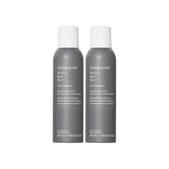 Living Proof Dry Shampoo bottle close-up illustrating root oil absorption.