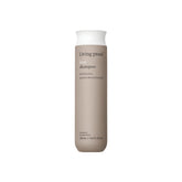 Living Proof No Frizz Shampoo bottle on shelf offers daily frizz control.
