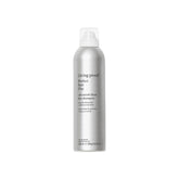 Living Proof phd dry shampoo bottle shows oil absorption for refreshed hair.