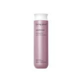 Living Proof Restore Conditioner bottle with label hints at stronger, healthier-looking hair.