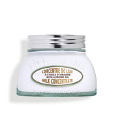 L'Occitane Almond Milk Concentrate bottle demonstrating hydrated, velvety skin feel.