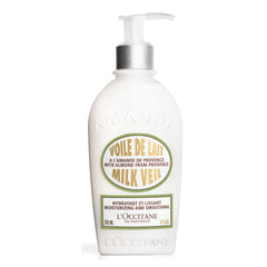 L'Occitane Almond Milk Veil bottle pour demonstrates fast-absorbing hydration for daily use.