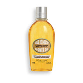 L'OCCITANE Almond Shower Oil bottle close-up, highlighting cleansing and skin-softening benefits.