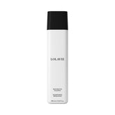LolaVie Restorative Shampoo bottle pour for a gentle bond-building cleanse.