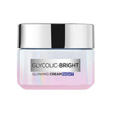 L’Oréal Paris crema de noche glicólico en envase elegante para brillo suave en la piel.