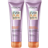L’Oréal Paris Frizz Defy Champú: botella con protección de color y control del frizz.